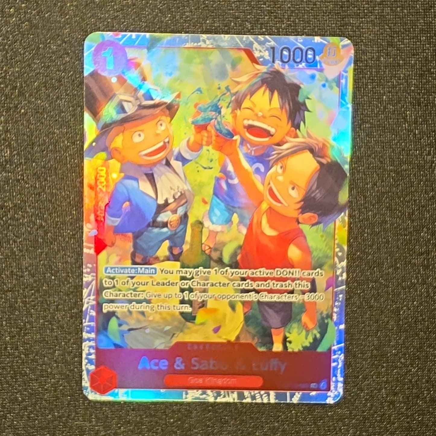Listing photo for Bandai One Piece Card Game Ace & Sabo & Luffy OP13-007 Rare Full Art Foil En