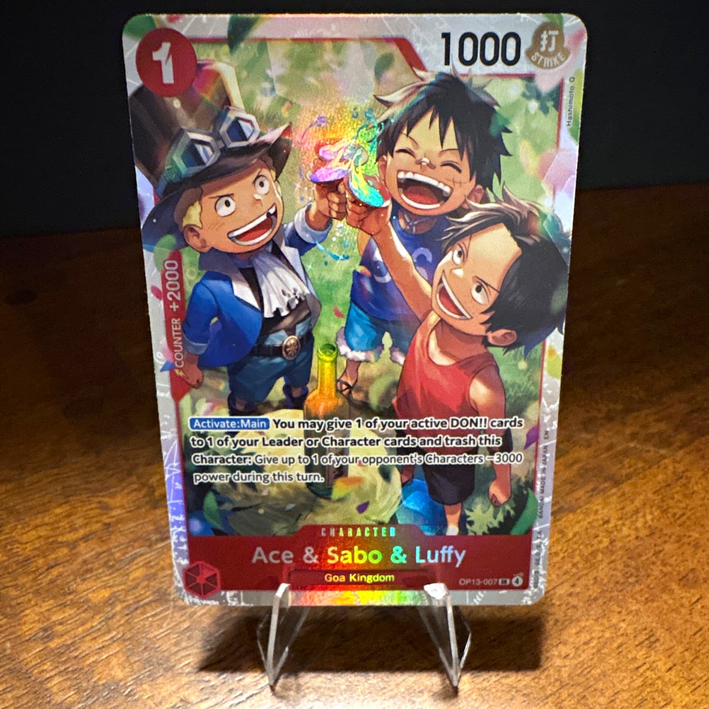 Listing photo for One Piece Card Game Rare Foil OP13-007 Ace & Sabo & Luffy EN 1000/1