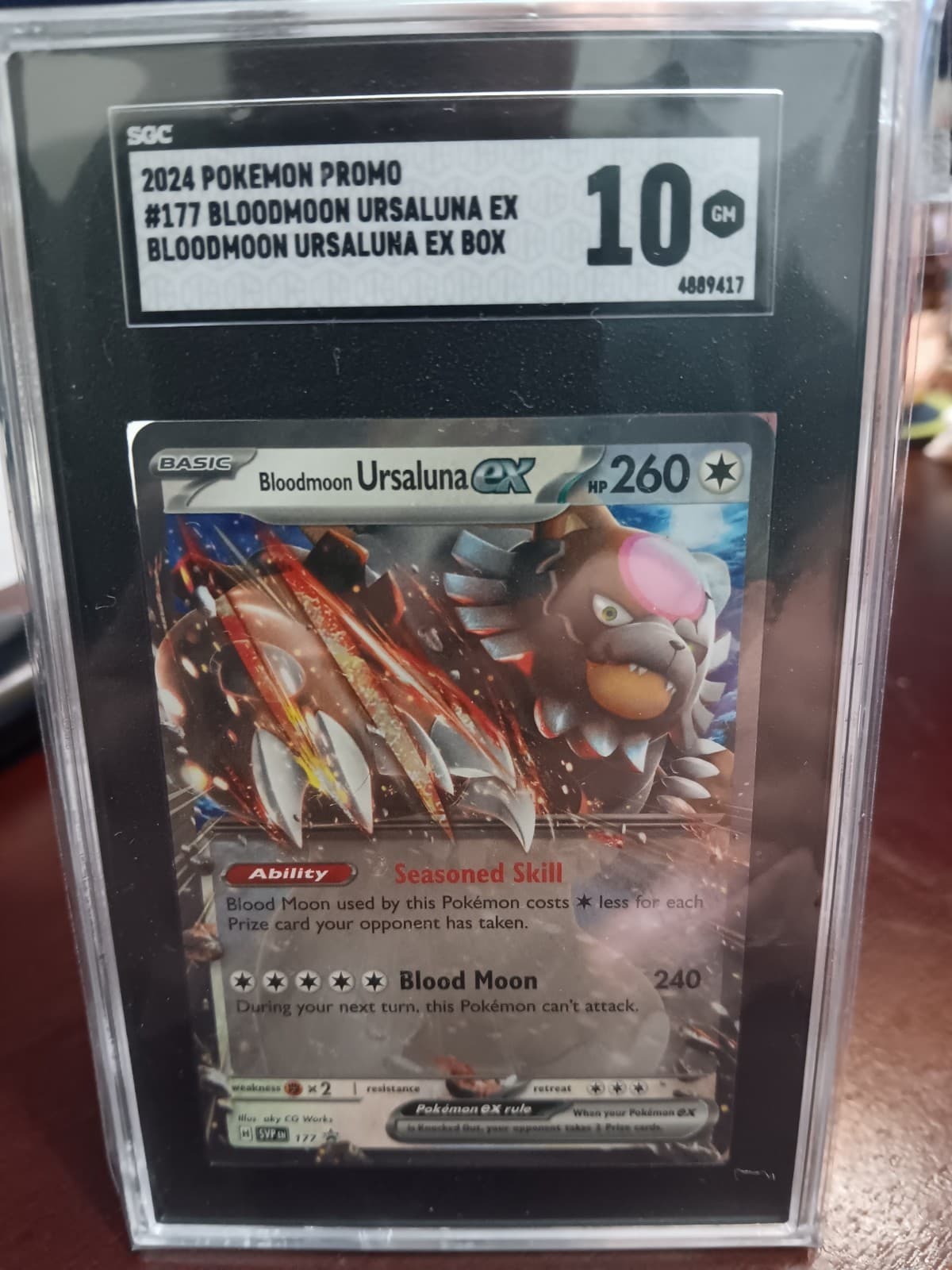 Listing photo for Pokémon TCG Bloodmoon Ursaluna ex CGC 10 Black Star Promo Holo #177 English 2024