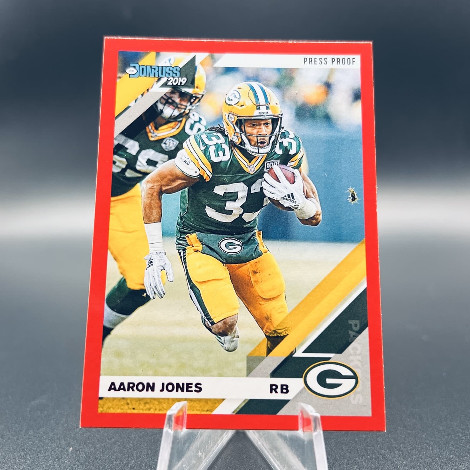 Listing photo for 2019 Panini Donruss Aaron Jones #100 Press Proof Red NFL Football Card Packers