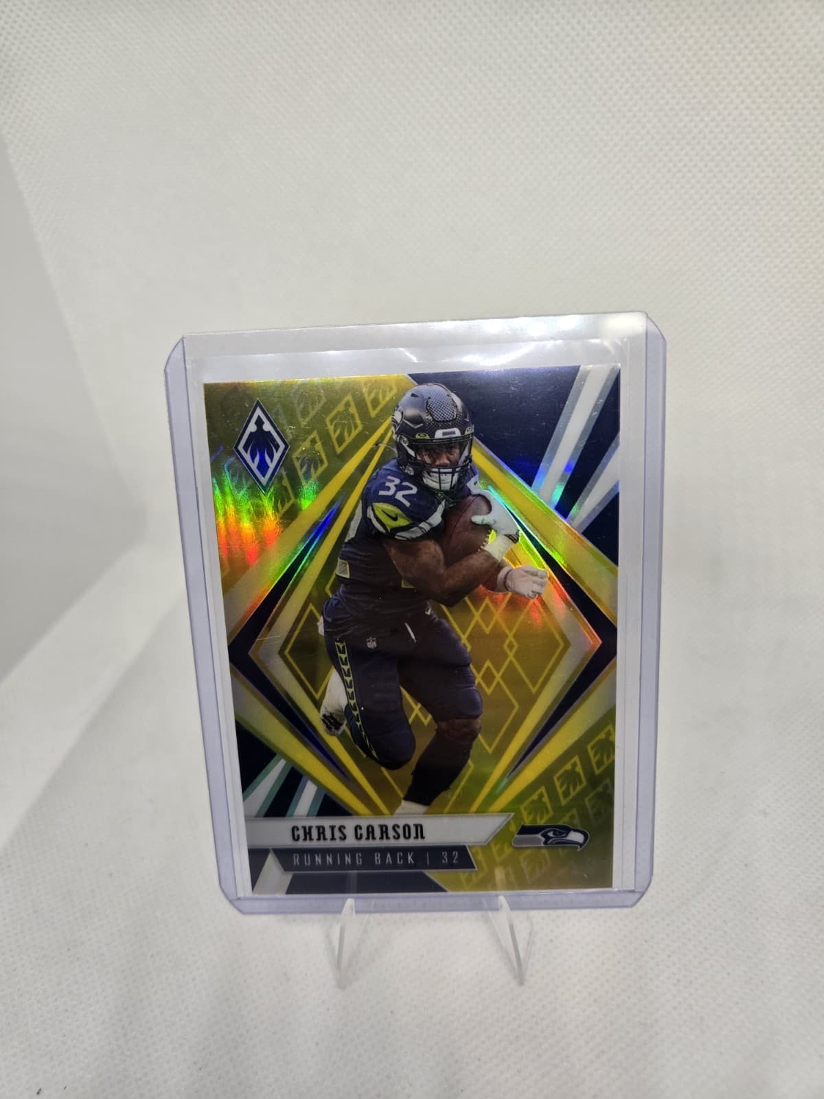 Listing photo for 2020 Panini Phoenix Yellow Chris Carson Parallel NFL Card 47/75 Seattle Seahawks